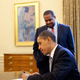 Joshua DuBois, director of the White House Office of Faith Based Initiatives, looks on as President Barack Obama signs the proclamation marking the National Day of Prayer in the Oval Office of the White House May 7, 2009.
Official White House Photo by Pete Souza